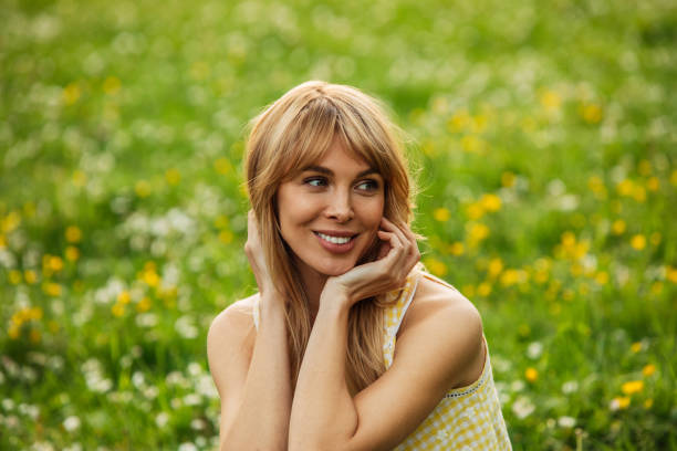 Smiling young woman enjoying summer