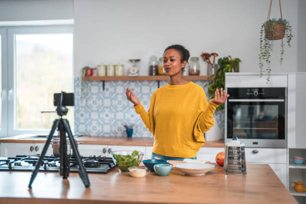 istock Charming Woman Sharing Nutritious Recipes in Home Kitchen Vlog 1497815743