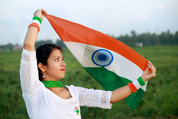 istock Women flying Indian flag in air 1497816610