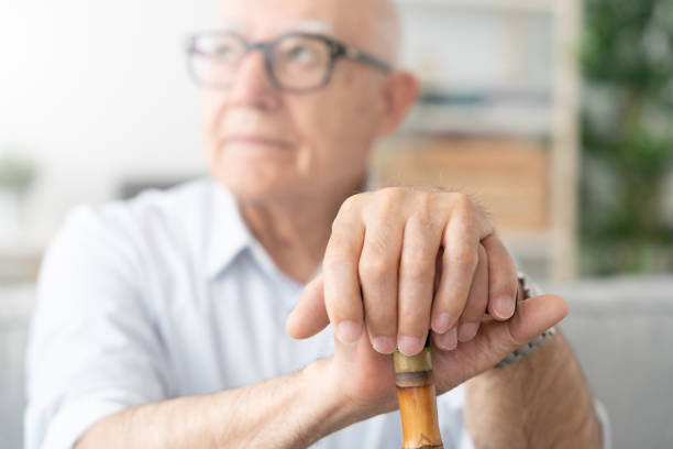 istock Hands of elderly man supported on walking stick 1497818588
