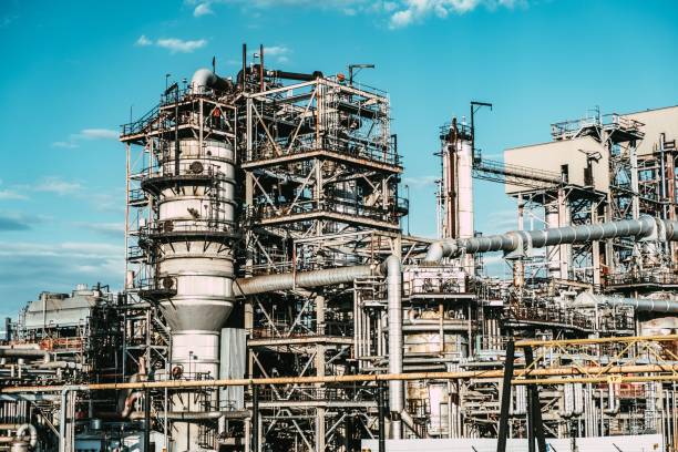 istock a large industrial building that has several pipes and chimneys in it 1497821123