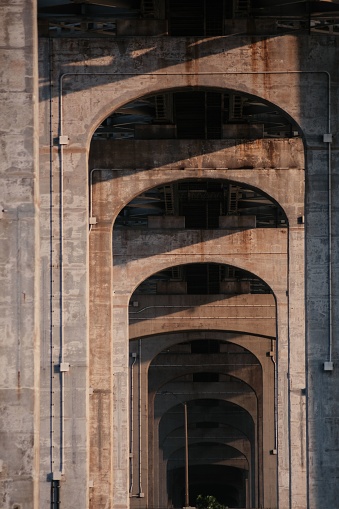 A modern brick archway with no windows on a sunny day