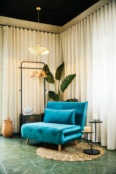 istock modern living room with a modern design featuring a blue couch and white curtain 1497823676