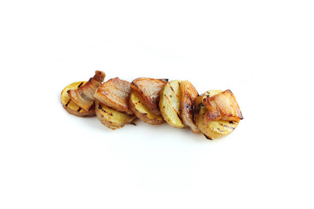 istock Hot baked potato topped with bacon isolated on the white 1497826812