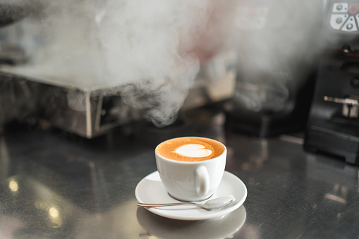 Find solace and comfort in the simple pleasure of a cup of coffee gracing the bar counter, ready to be savored.