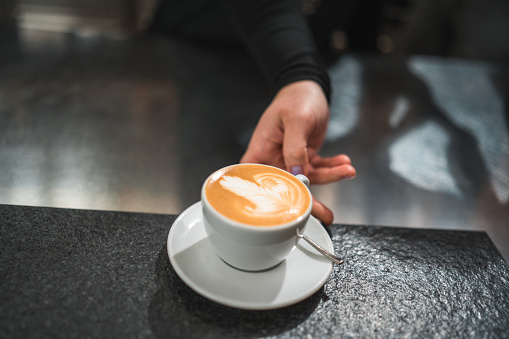 Experience the charming ambiance of the cafeteria, where the coffee cup becomes a canvas for intricate latte art, showcasing the dedication and artistry of the baristas.