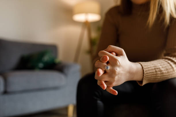 istock Young woman anxiously cracking her knuckles, struggling with negative emotions 1497831877