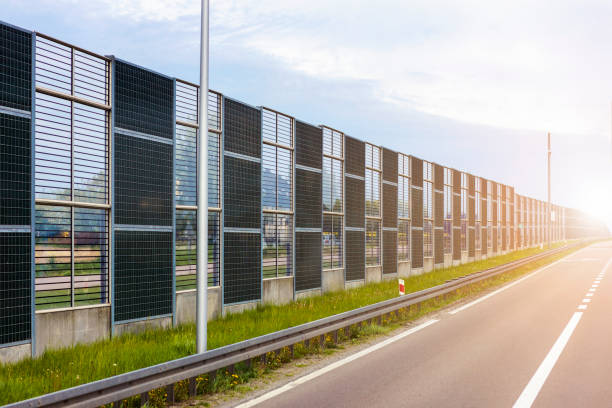 Asphalt Road Autobahn with Soundproofing wall of modern Highway. Sound-absorbing  Expressway equipped with sound-absorbing screens. autobahn with