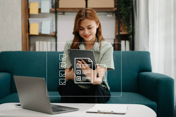 istock Checklist and filling survey form online. Document management system, DMS. Assessment form, questionnaire, checklist .Quality control and accuracy Check completeness.using a laptop and tablet 1497833992