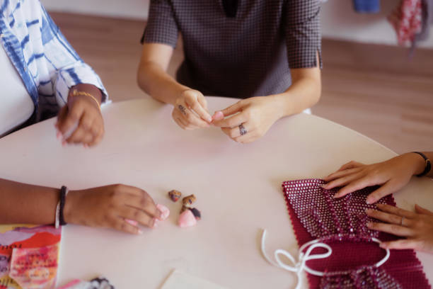 istock Close Up of Hands Small Group of Multicultural Friends on Round Table 1497837997
