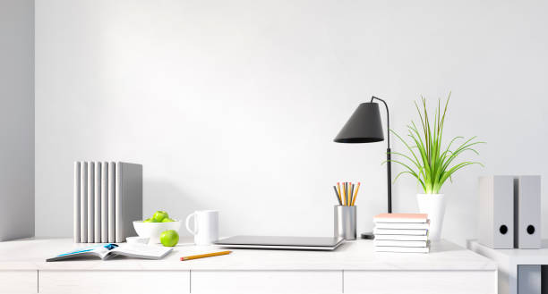 istock Modern home office desk against white wall 1497839194