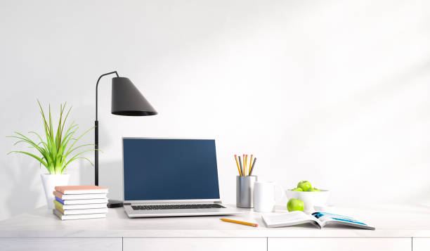 istock Modern home office desk against white wall 1497839200