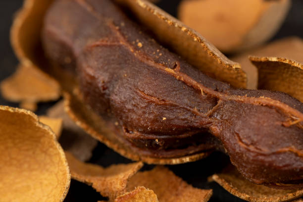 istock open ripe tamarind pods with edible pulp 1497839819
