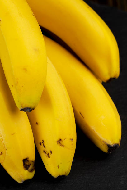 istock a branch of fresh bananas on the table 1497839857