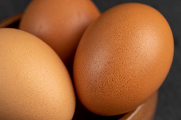 istock A whole orange chicken egg close-up on the table 1497839869