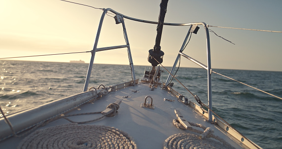 Sail, closeup and a boat on the water for travel, luxury cruise or adventure during summer. Sailing, ship and a yacht on the ocean for a holiday, vacation or to explore nature at sea