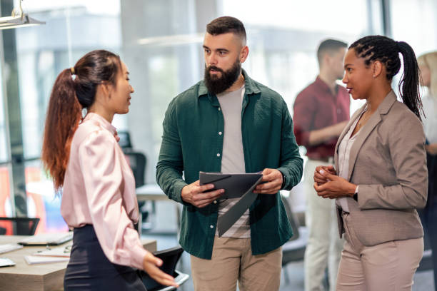 istock A business team is standing in a modern office and having a discussion 1497841128