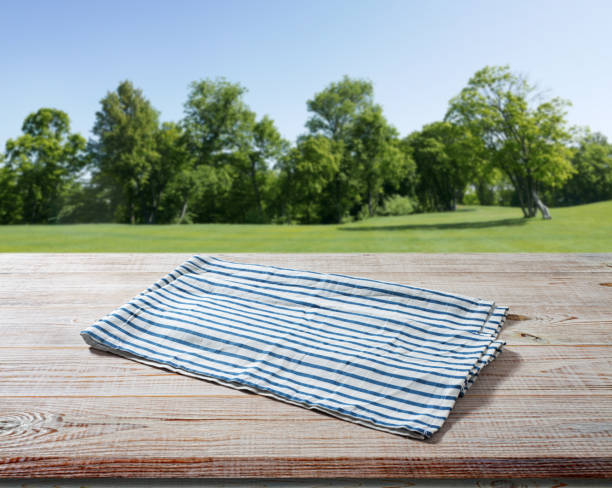 istock Napkin. Tablecloth, dish towels on wooden table perspective. Summer background. 1497841702