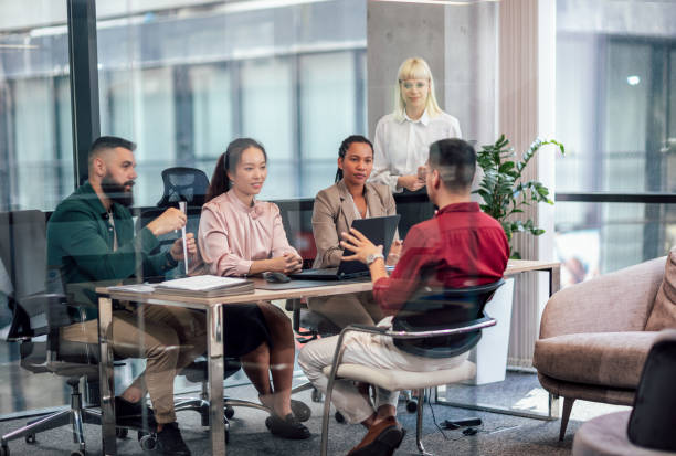 istock Human resource team talking to a candidate during a job interview in the office. 1497842276
