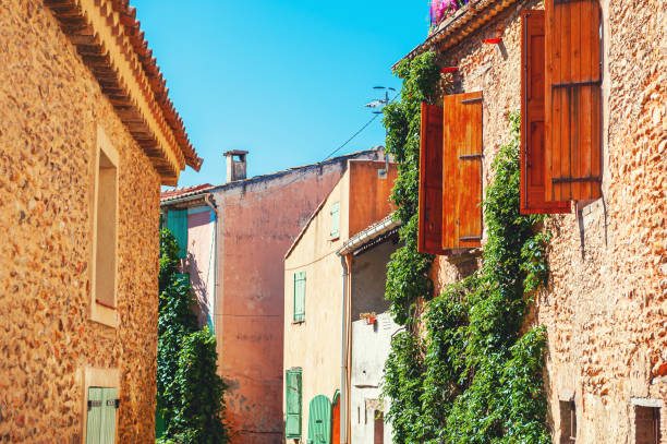 Old architecture on the cozy street in Valensole, Provence, France. Old architecture on the cozy street in Valensole, Provence, France. Famous tavel destination plateau de valensole stock pictures, royalty-free photos & images
