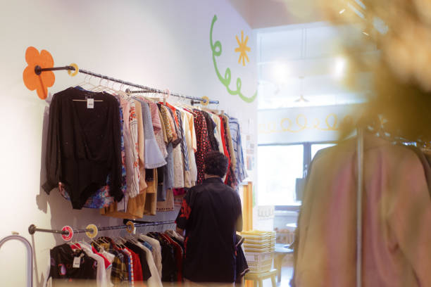 istock A Person Looking Through Secondhand Clothes at Local Thrift Shop 1497842930