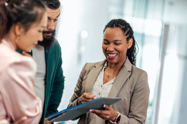 istock A business team is standing in a modern office and having a discussion 1497842970