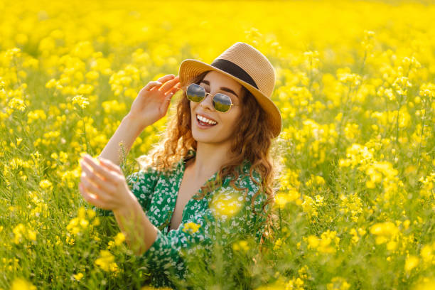 istock Beautiful woman in the blooming field. 1497846821