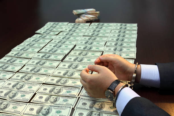 istock Bribe. Arrested for bribery. Caught red-handed. 1497846892