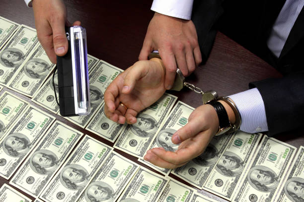 istock Bribe. Arrested for bribery. Caught red-handed. 1497846916