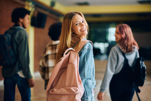 istock Happy female high school student looking at camera. 1497850462