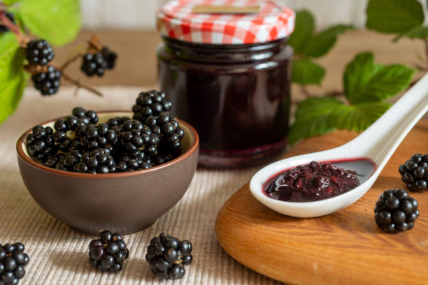 istock Blackberries in basket with blackberry jam or jelly 1497851854