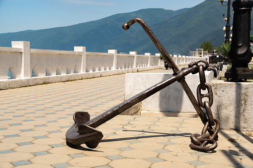 metal anchor as a monument near the sea