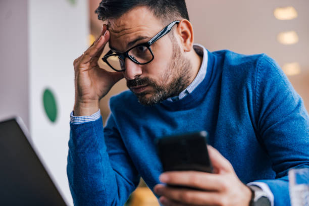 istock Frustrated man having a business problem at the office, looking at his laptop. 1497857257