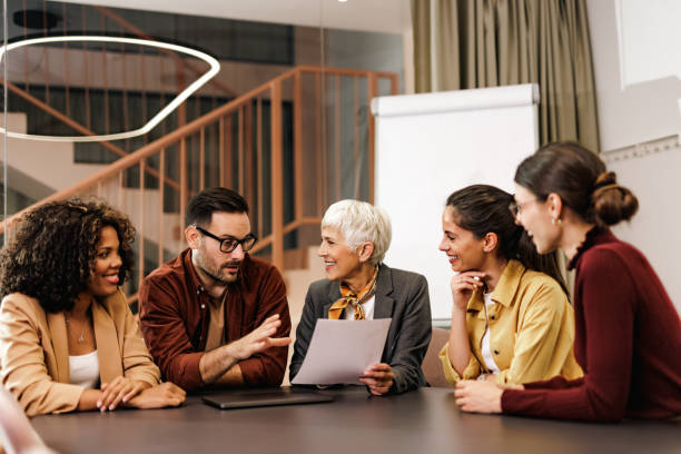 istock Businessman taking a word, talking, working with his female colleagues. 1497857740