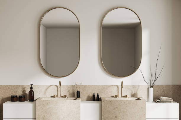 istock White bathroom interior with double sink, close up 1497862428