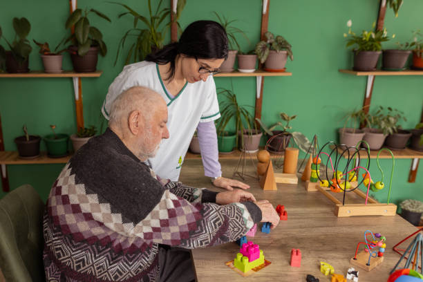 istock Giving challenges to an elderly man with Alzheimer 1497862469