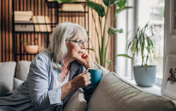 istock Senior woman drinking coffee and relaxing a home 1497862653