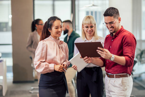 istock A business team is standing in a modern office and having a discussion 1497862785