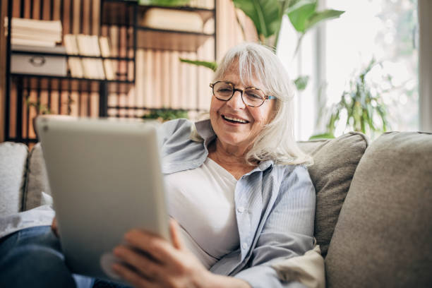 istock Senior woman using digital tablet at home 1497862903