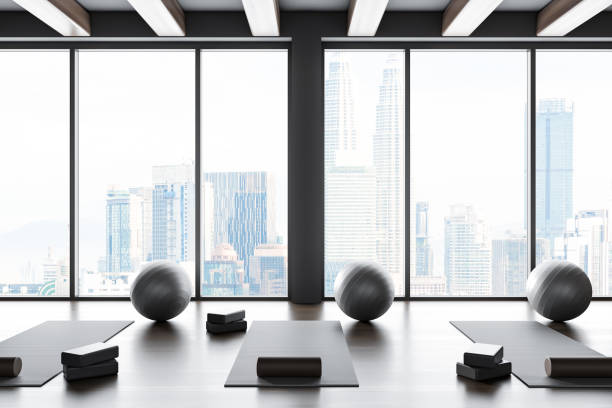 istock Dark sport class interior with sport equipment in row and panoramic window 1497863008
