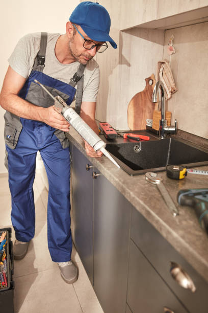 istock Handyman fixing kitchen cabinets in the apartment. 1497865174