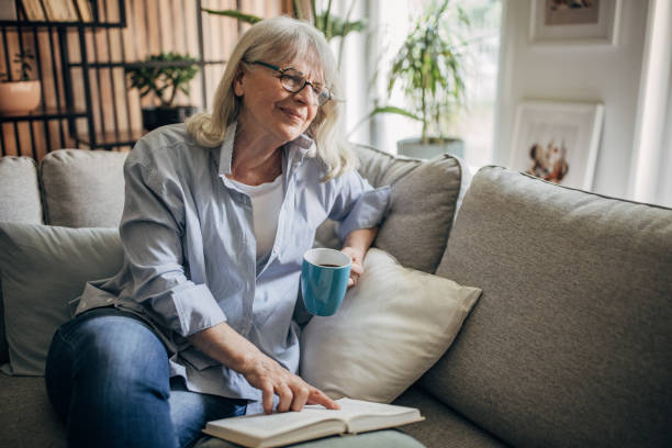 istock Senior woman drinking coffee and relaxing a home 1497866105