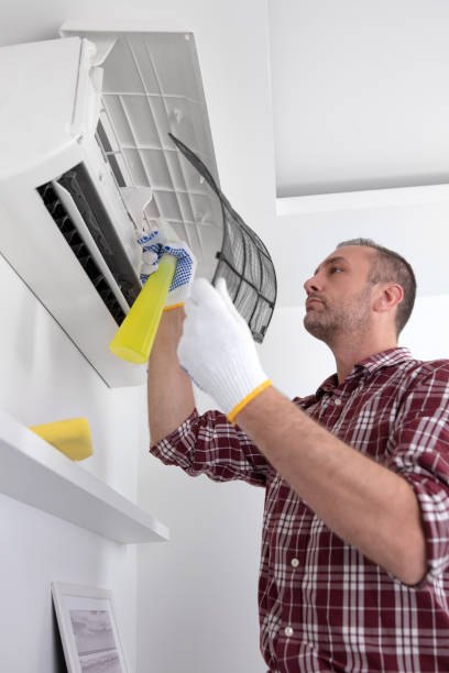 istock Service guy cleaning and maintaining air condition unit. 1497866435