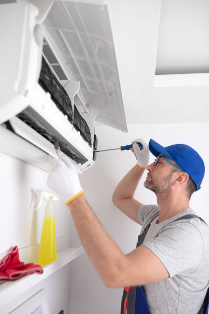 istock Service guy cleaning and maintaining air condition unit. 1497866475