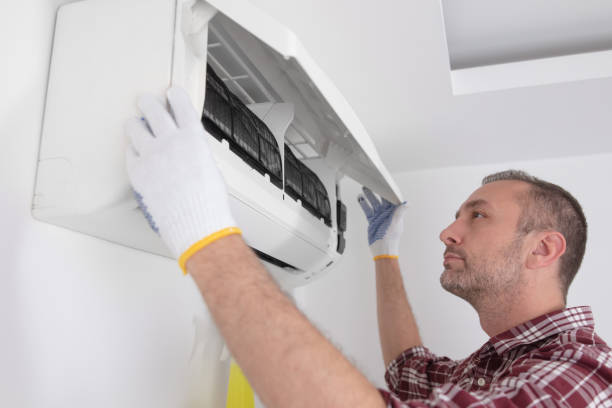 istock Service guy cleaning and maintaining air condition unit. 1497866529