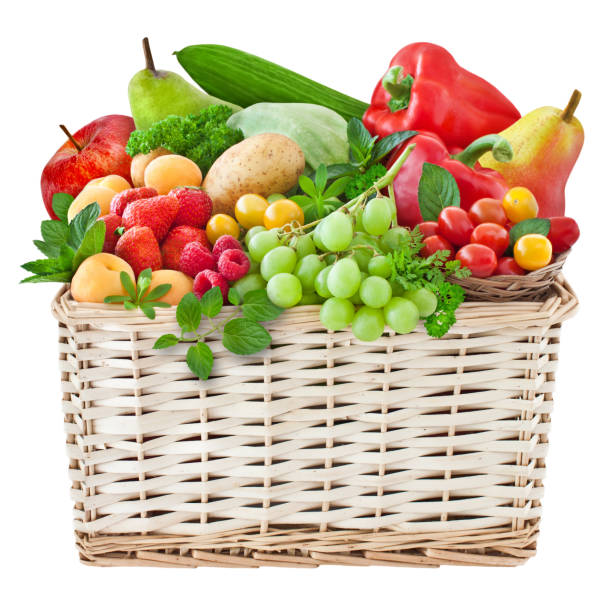 istock Various fresh fruits and vegetables in a basket isolated on white background 1497870471