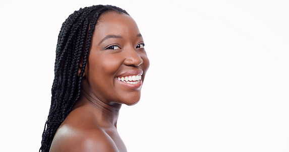 Skincare, makeup and portrait of a woman with confidence isolated on a white background for cosmetics. Health, dermatology and natural beauty, African model in studio for healthy skin care and wellness