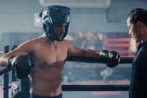 istock The referee's role in a boxing match is to enforce rules during each round, advice fighters before the competition begins. Determining when a boxer's health is at risk. Signaling when a round is over 1497870829