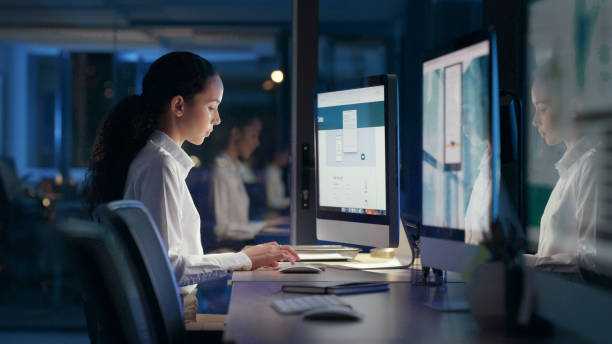 istock Professional businesswoman typing in company data on her computer working overtime in the office. Smart, confident and serious young female doing her job late night to meet her deadline at her desk 1497871920