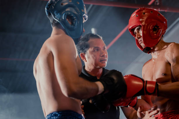 istock The referee's role in a boxing match is to enforce rules during each round, advice fighters before the competition begins. Determining when a boxer's health is at risk. Signaling when a round is over 1497872003